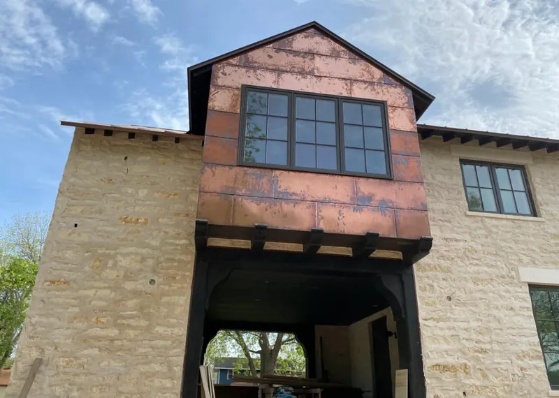 Copper metal panel facade on a stone building for Metal Roof Coating in Crest Hill